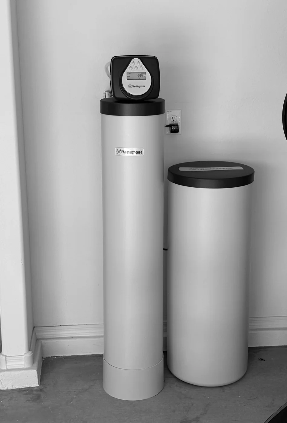 Westinghouse whole-home treatment tanks installed in a residential utility area
